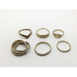 A collection of six 9ct gold rings including a Rus