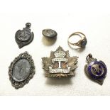 A gold ring, Southend football medal, military bad