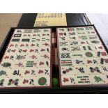 A Mahjong set and a vintage monopoly game .