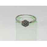 A 9ct white gold seven stone diamond ring, approx