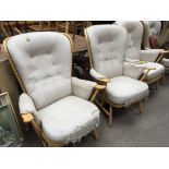 A set of four blonde Ercol arm chairs with cram up