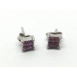 A pair of 18ct white gold earrings set with pink s