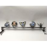 Vintage car badge bar with five badges