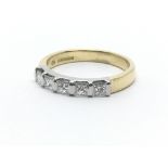 An 18ct yellow gold and five stone diamond ring, a