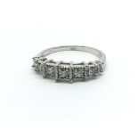 An 18ct white gold ring having seven diamonds, app