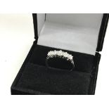 An 18ct white gold diamond set 5 stone ring, appro