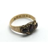 An antique 22ct gold ring inset with garnets, appr