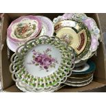 A box of mixed wall and ribbon plates.