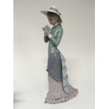 A large Lladro figure of a young lady in full leng