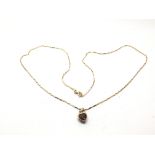 A 9ct gold heart shaped pendant on chain, approx 3