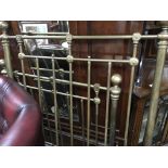 A brass single bedstead with vertical supports - N