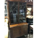 A 1920s Mahogany bookcase cupboard with geometric