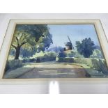 A framed watercolour of a windmill by Alan Runagal