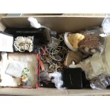 A box of costume jewellery and quartz watches.