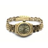 A ladies 18ct gold Rolex Oyster perpetual watch, a
