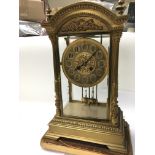 A Quality Victorian gilt metal four glass clock wi