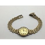 A 9ct gold Fish Bros ladies quartz watch, not work