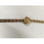 A 9ct gold laddies wrist watch with gold strap tot