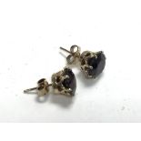 A pair of 9ct gold and garnet studs.