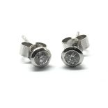 A pair of platinum diamond stud earrings marked 95