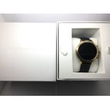 A boxed Michael Kors smart watch.