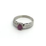 An 18ct white gold .50ct ruby centre stone, with d