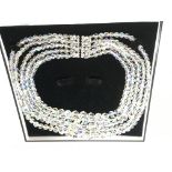 A five strand aurora crystal necklace.