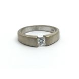 An 18ct white gold and princess cut diamond solita