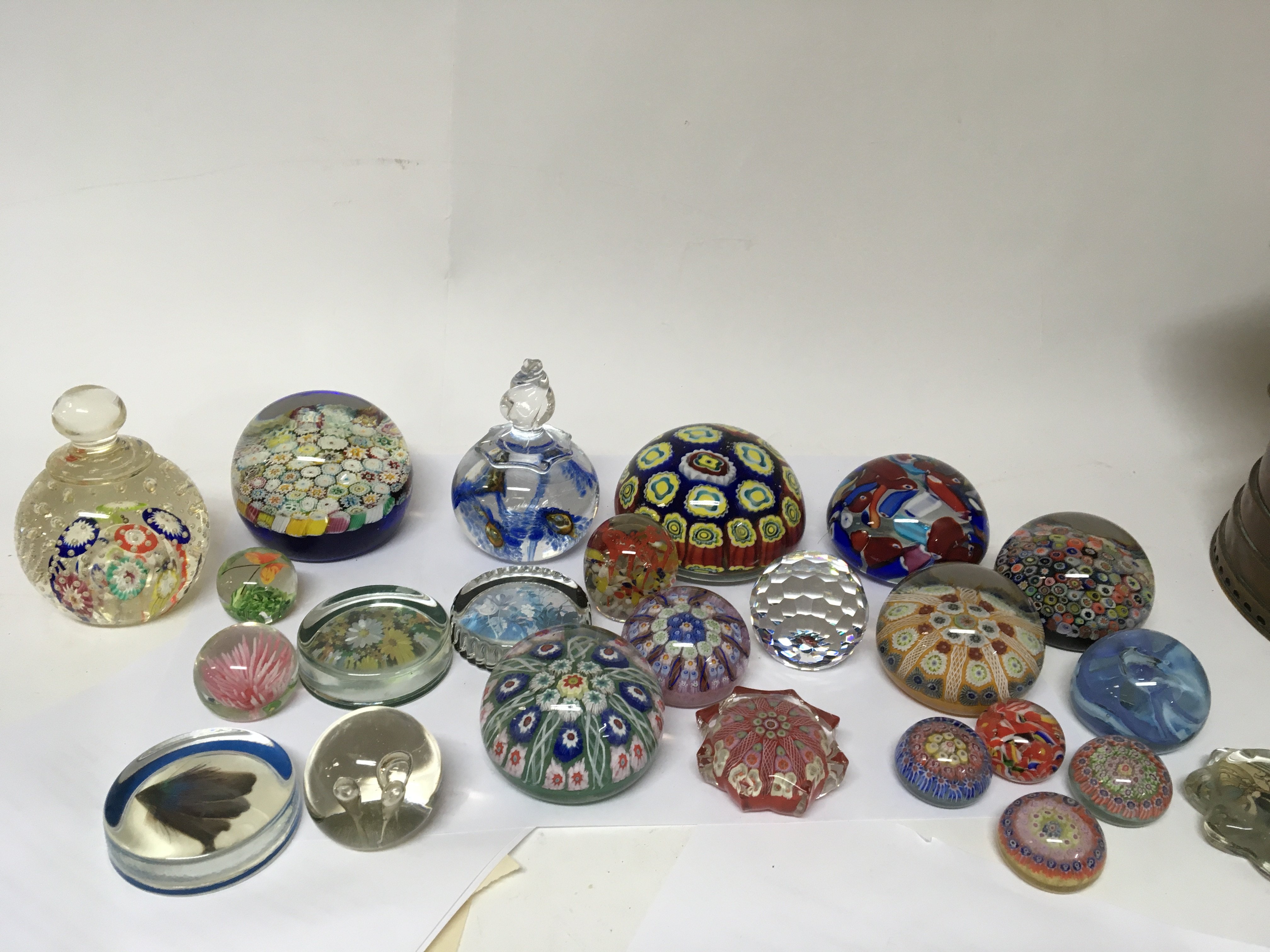 A collection of paperweights including Murano Mill