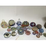A collection of paperweights including Murano Mill