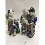 Two Japanese Imari figure groups decorated in colo