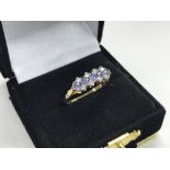 A 9ct gold diamond and tanzanite set ring.