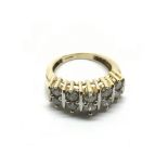 A 9ct gold diamond ring set with ten diamonds, app