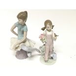 Two Lladro figures a young ballerina and a girl ho
