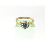 An unmarked gold ring set with a 1.51ct diamond, V