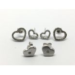 Three pairs of 18ct white gold heart shaped diamon