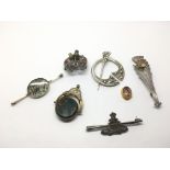 A collection of silver brooches including Scottish
