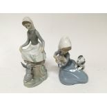 Two Lladro figures of young girls one holding a ca