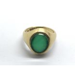 An 18ct gold ring set with jade, approx 8.7g and a