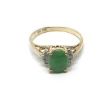 A 14ct gold ring set with jade and diamonds, appro