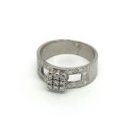 An 18carat white gold ring set with a buckle type
