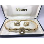 A cased Monet necklace and a matching pair of earr