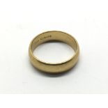A 22ct gold wedding band, approx 7g.
