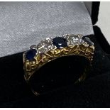 A heavy 18ct gold sapphire and diamond 5 stone rin