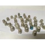 A good collection of silver thimbles including one
