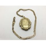 A 9ct gold locket and chain, approx 13.4g.
