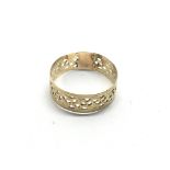 An unmarked gold ring with piercework decoration,