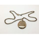 A 9ct gold belcher chain with an open face locket,