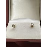 A pair of yellow gold stud earrings inset with dia