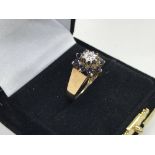 A 9ct gold sapphire and diamond set ring.